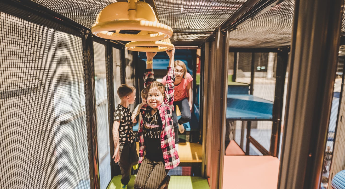 young children on the ninja obstacle course