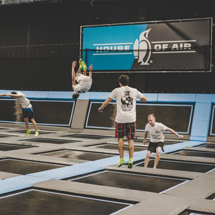 young adults jumping on the main floor of house of air San Antonio