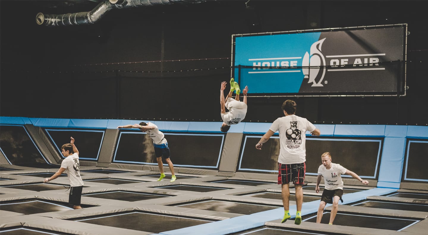 young adults jumping on the main floor of house of Air San Antonino