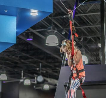girl on zip line at HOA San Antonio