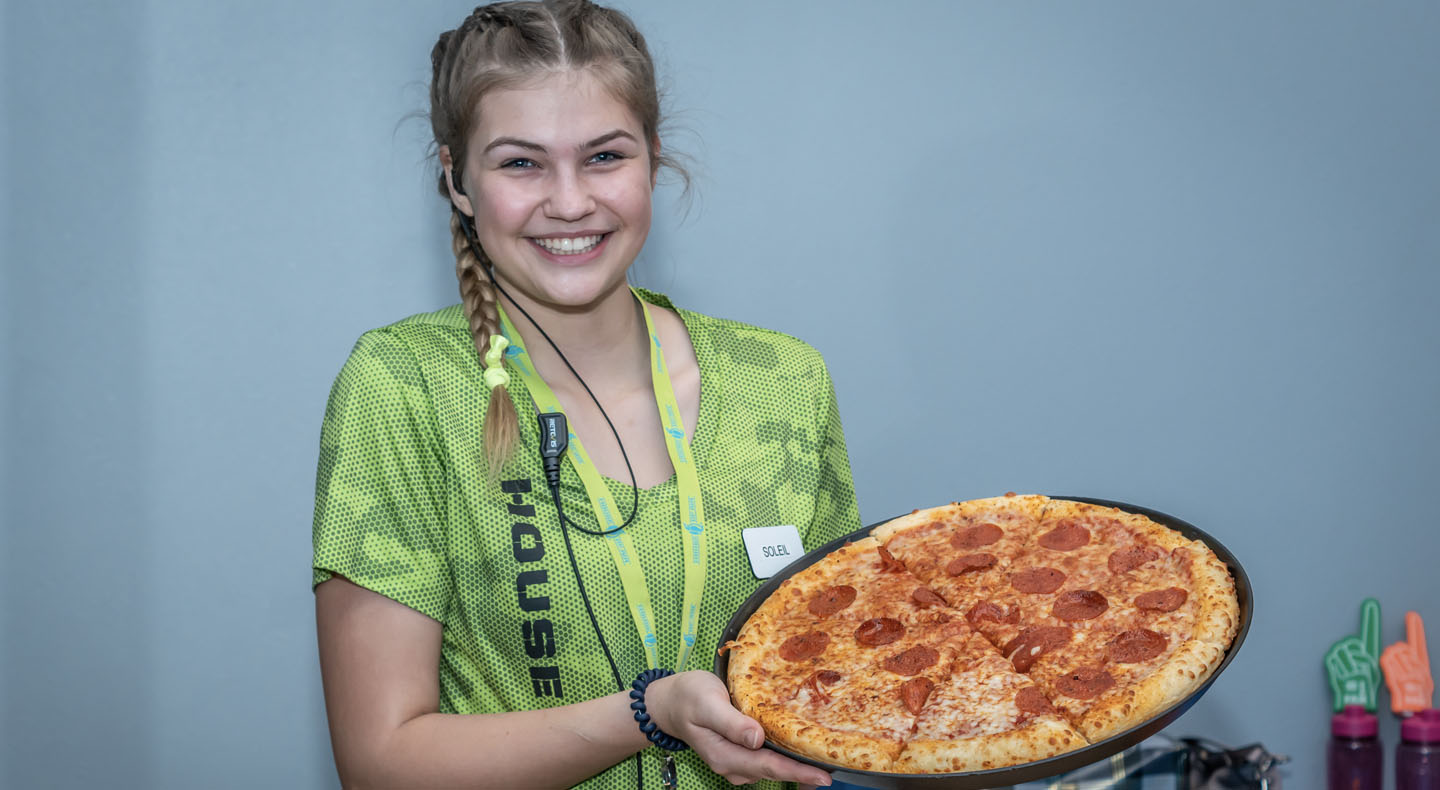 young-women-holding-a-pizza-HOA