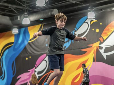 young boy jumping at HOA