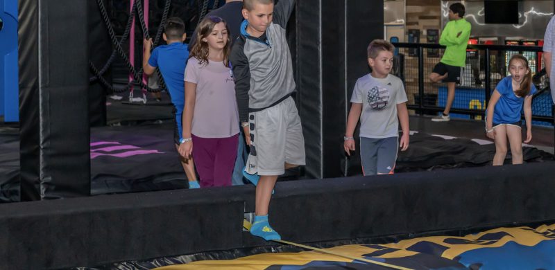 young male balances on balance line HOA